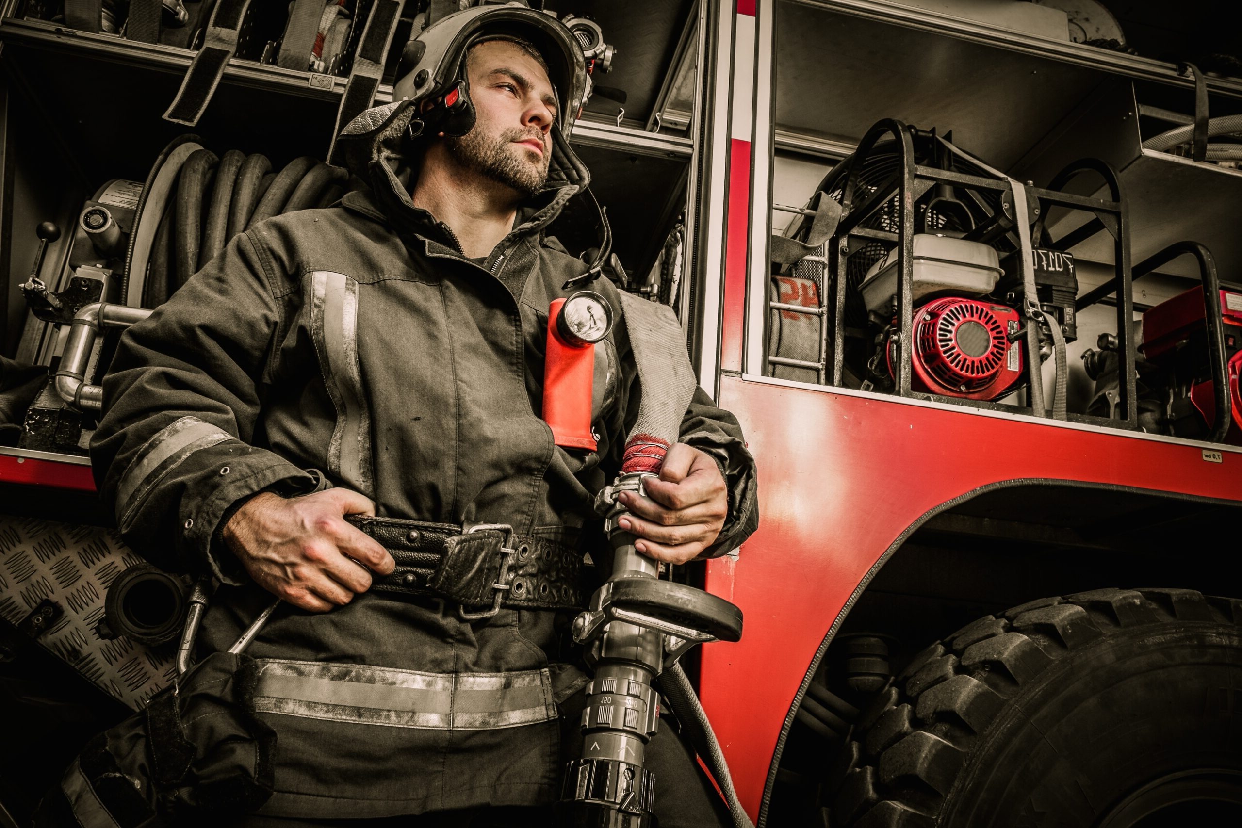 bigstock Firefighter near truck with eq 65952256 scaled e1744207260651